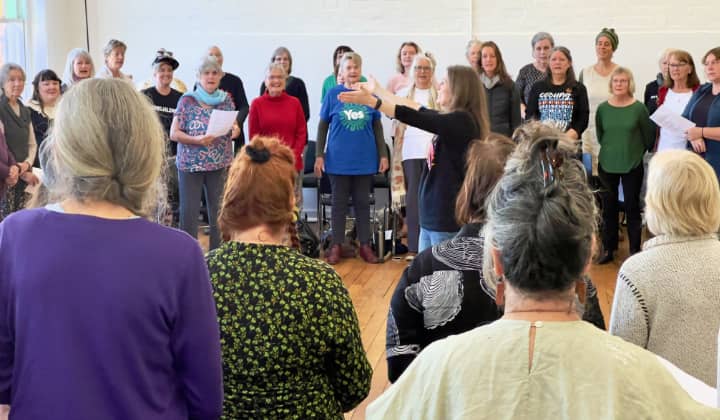 WolfSong Women choir rehearsing together in a community hall in Lismore NSW