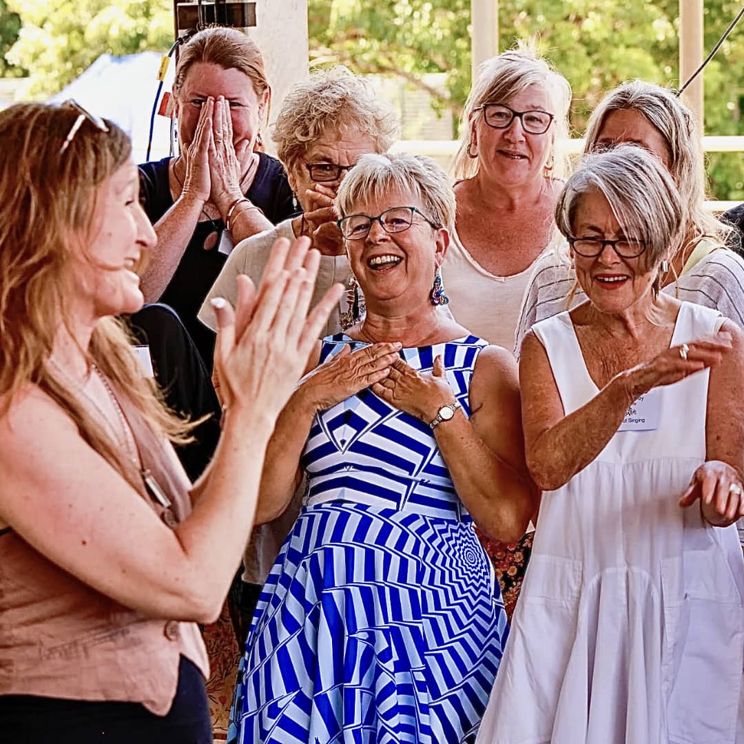 WolfSong choir members sharing laughter together during rehearsal