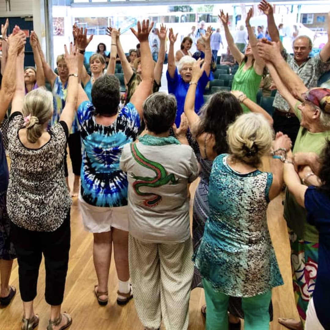 SeaSong choir performing end-of-rehearsal ‘woooosh!’ with expressive movement
