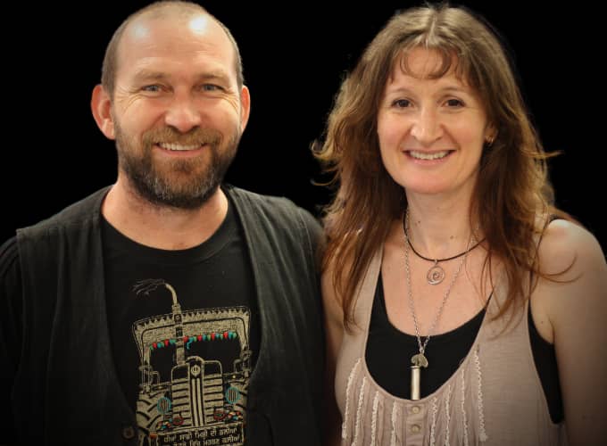 Portrait of Imogen Wolf and Brian Martin, facilitators at Camp Creative, against a black backdrop