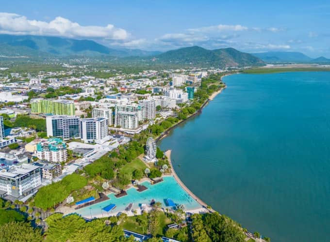 Aerial view of the Cairns foreshore and lagoon with mountainous backdrop